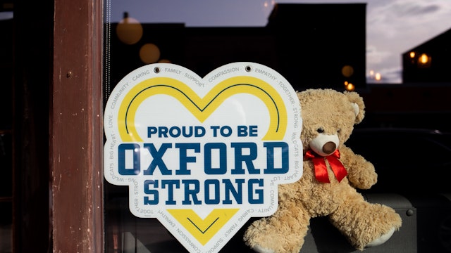 A sign on display in windows of a business to show support for Oxford High School on December 7, 2021 in Oxford, Michigan.