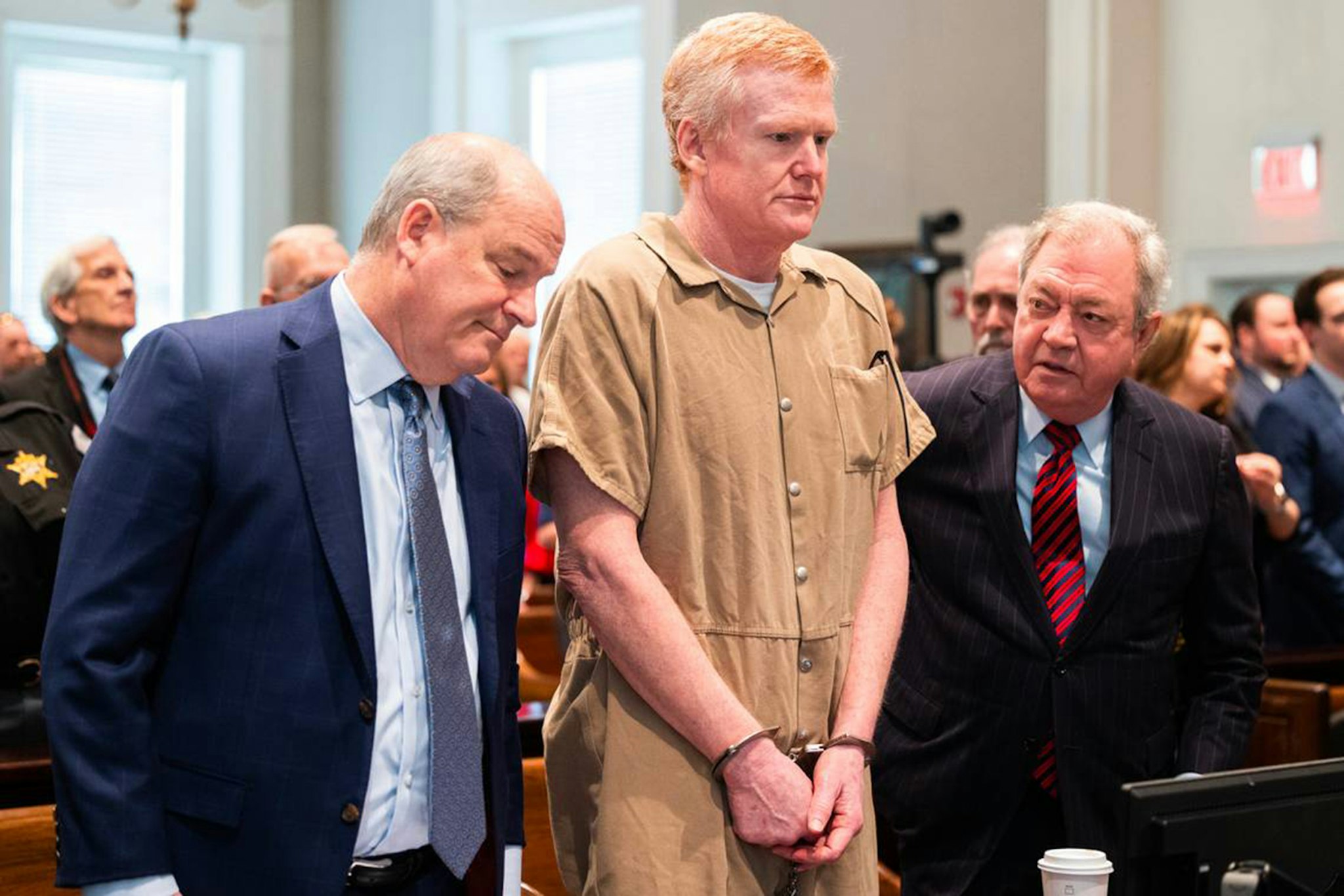 Alex Murdaugh speaks with his legal team before he is sentenced to two consecutive life sentences for the murder of his wife and son by Judge Clifton Newman at the Colleton County Courthouse on Friday, March 3, 2023.