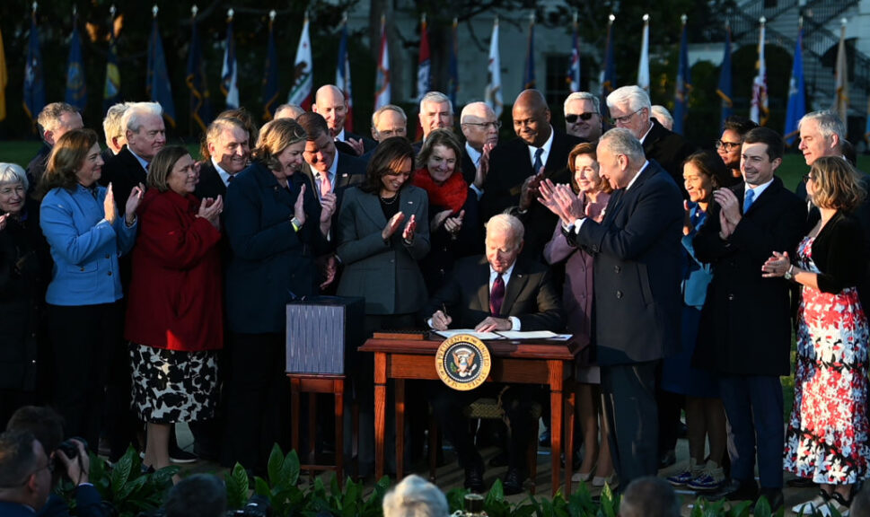 WASHINGTON, DC - NOVEMBER 15: U.S. President Joe Biden (C) signs H.R. 3684, the Infrastructure Investment and Jobs Act, during a ceremony on the South Lawn at the White House on November 15, 2021 in Washington, DC. (Photo by Chen Mengtong/China News Service via Getty Images)