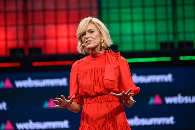 LISBON, PORTUGAL - NOVEMBER 13: Web Summit CEO Katherine Maher gestures while delivering remarks onstage at Altice Arena during the first day of the event on November 13, 2023 in Lisbon, Portugal. The annual conference brings together founders and CEOs of technology companies, as well as policymakers, to discuss the future of the Web. The 2023 event is expected to reach full capacity at more than 70,000 attendees from 160 countries, plus 2,600 startups and more than 300 partners who will be present to interact with more than 800 speakers and some 2,000 members of the media. This year's summit on the Internet technology industry is the first under the newly appointed Web Summit CEO Katherine Maher, who replaced Paddy Cosgrave following his resignation last month. (Photo by Horacio Villalobos#Corbis/Getty Images)