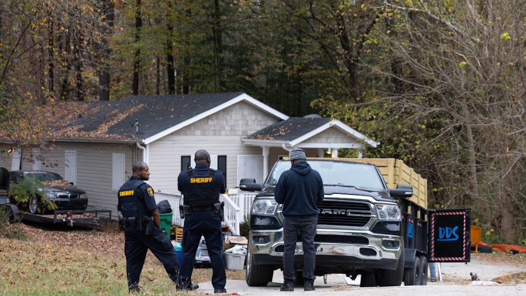 Police supervise the removal of items that belong to squatters from the premises of a rental property in Ellenwood, Georgia, US, on Friday, Nov. 17, 2023. An estimated 1,200 homes are illegally occupied in the Atlanta metro area, an epicenter for institutional investors. Photographer: