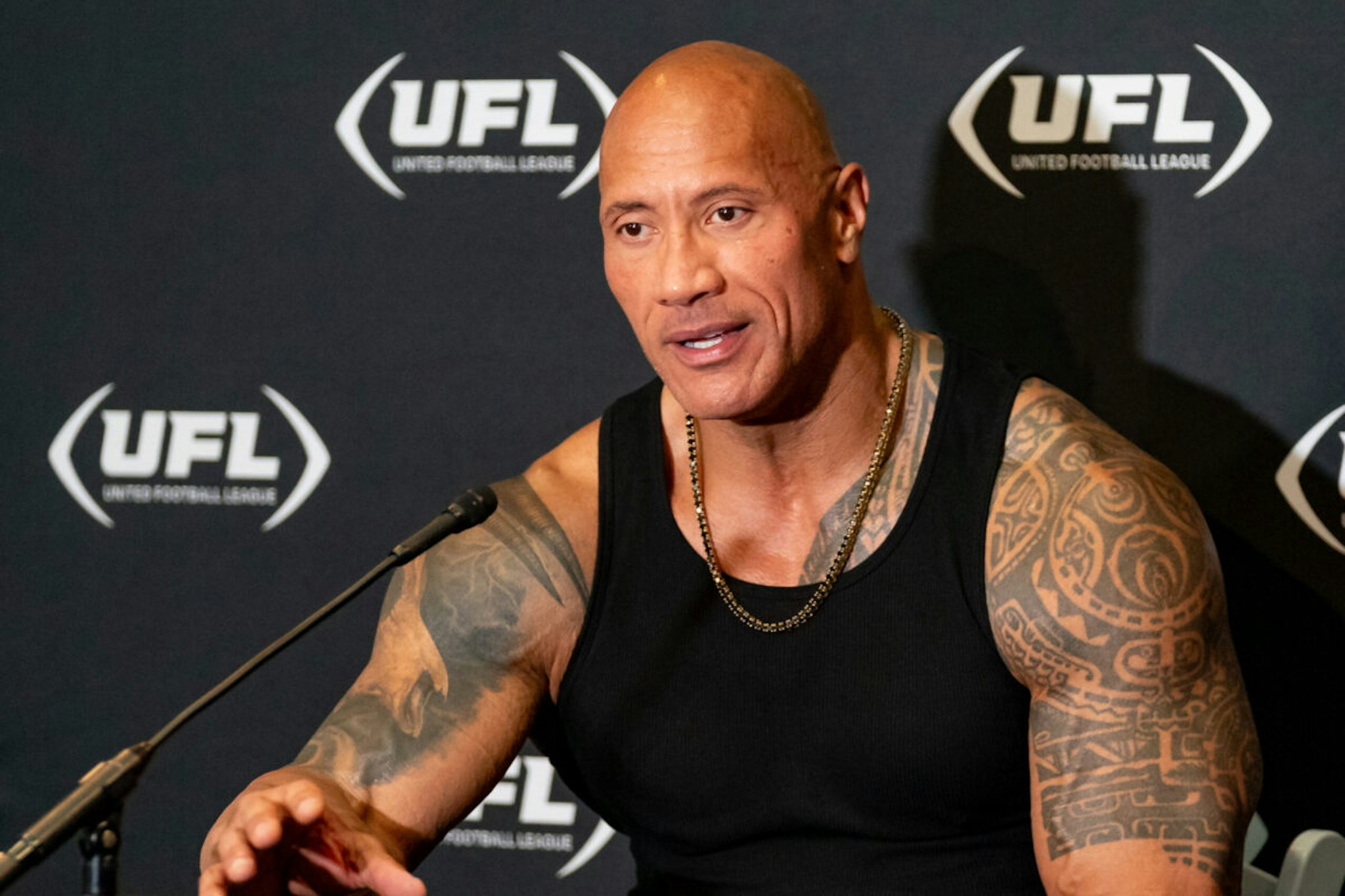 ARLINGTON, TX - MARCH 30:UFL owner Dwayne Johnson, The Rock, smiles during a press conference during a UFL game between the Birmingham Stallions and the Arlington Renegades on March 30, 2024 at Choctaw Stadium in Arlington, TX.