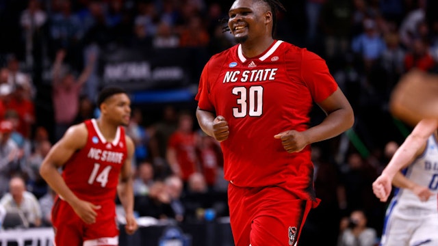 DALLAS, TEXAS - MARCH 31: DJ Burns Jr. #30 of the NC State Wolfpack reacts following a basket during the second half against the Duke Blue Devils in the Elite 8 round of the NCAA Men's Basketball Tournament at American Airlines Center on March 31, 2024 in Dallas, Texas. (Photo by Lance King/Getty Images)