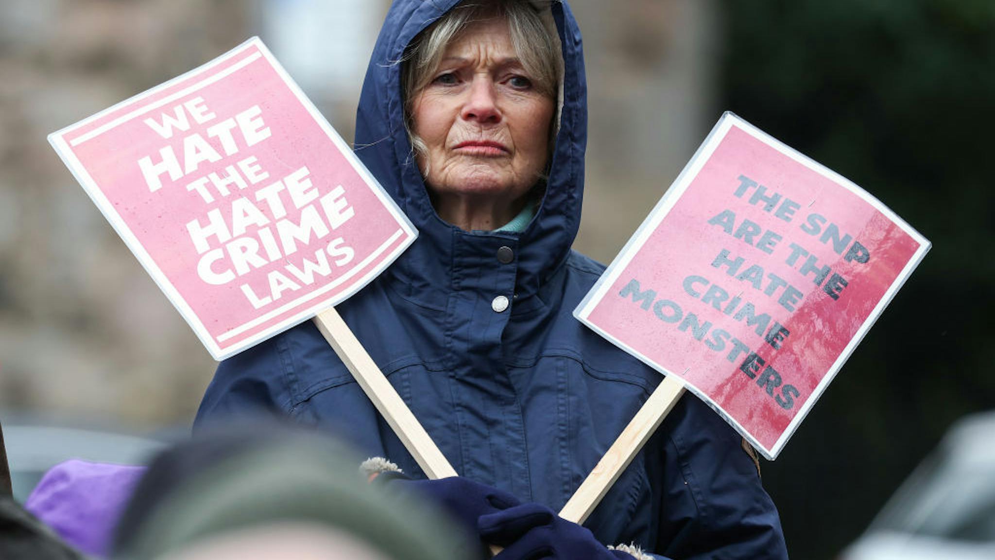 Demonstrators Rally Outside Holyrood Against SNP’s Hate Crime Bill EDINBURGH, SCOTLAND - APRIL 01: Protesters demonstrate outside the Scottish Parliament as Scotland’s Hate Crime Law comes into force on April 01, 2024 in Edinburgh, Scotland. The hate crime bill, introduced today, criminalises 'threatening or abusive behaviour' intended to stir up hatred against someone's identity. It extends protection to groups including religion, age, disability, sexual orientation, and transgender identity, and applies in people's private homes and online. Despite being passed three years ago, its implementation was postponed due to concerns regarding enforcement. (Photo by Jeff J Mitchell/Getty Images)