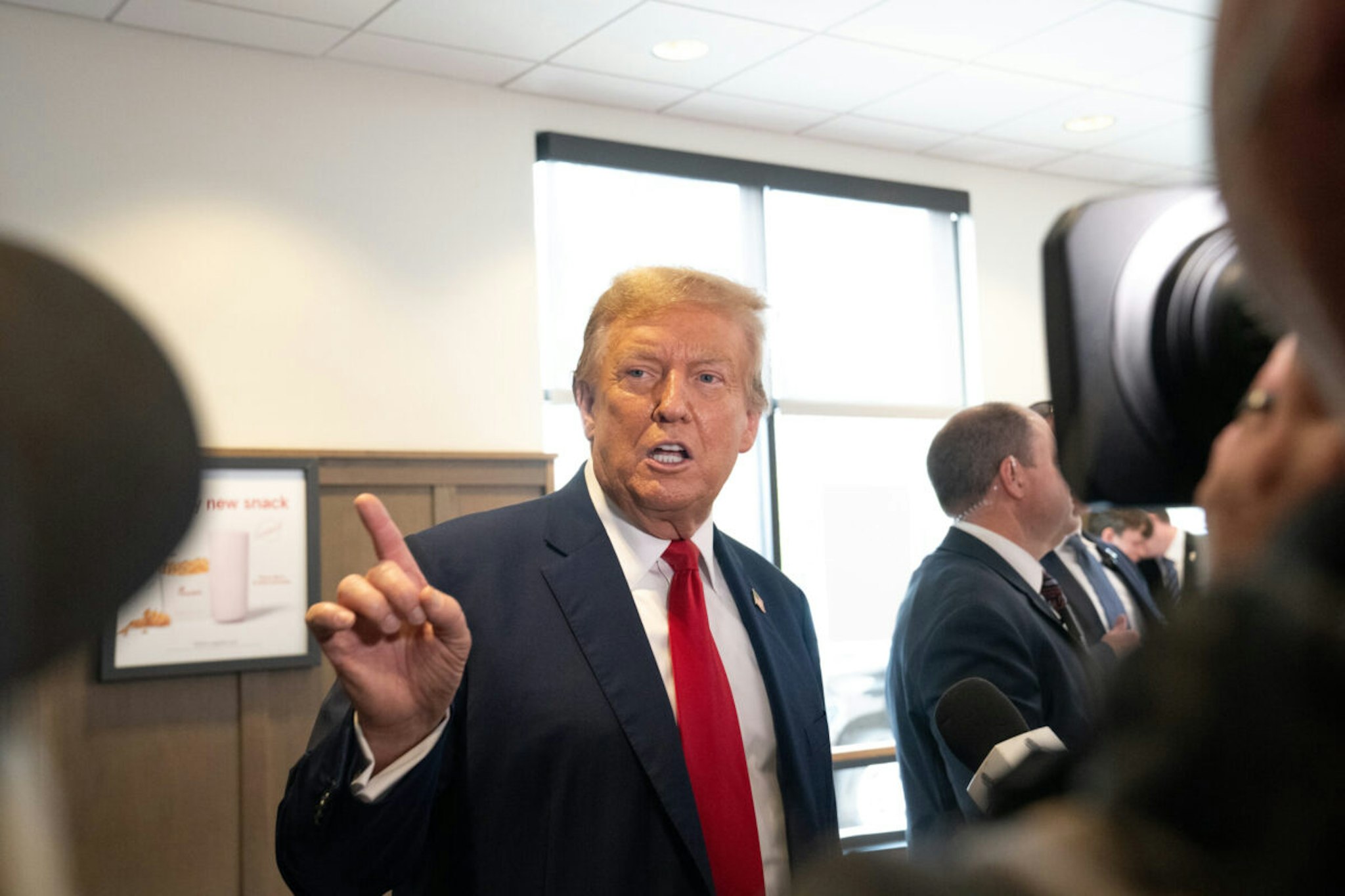 Former U.S. President Donald Trump speaks to the media during a visit to a Chick-fil-A restaurant on April 10, 2024 in Atlanta, Georgia. Trump is visiting Atlanta for a campaign fundraising event he is hosting.