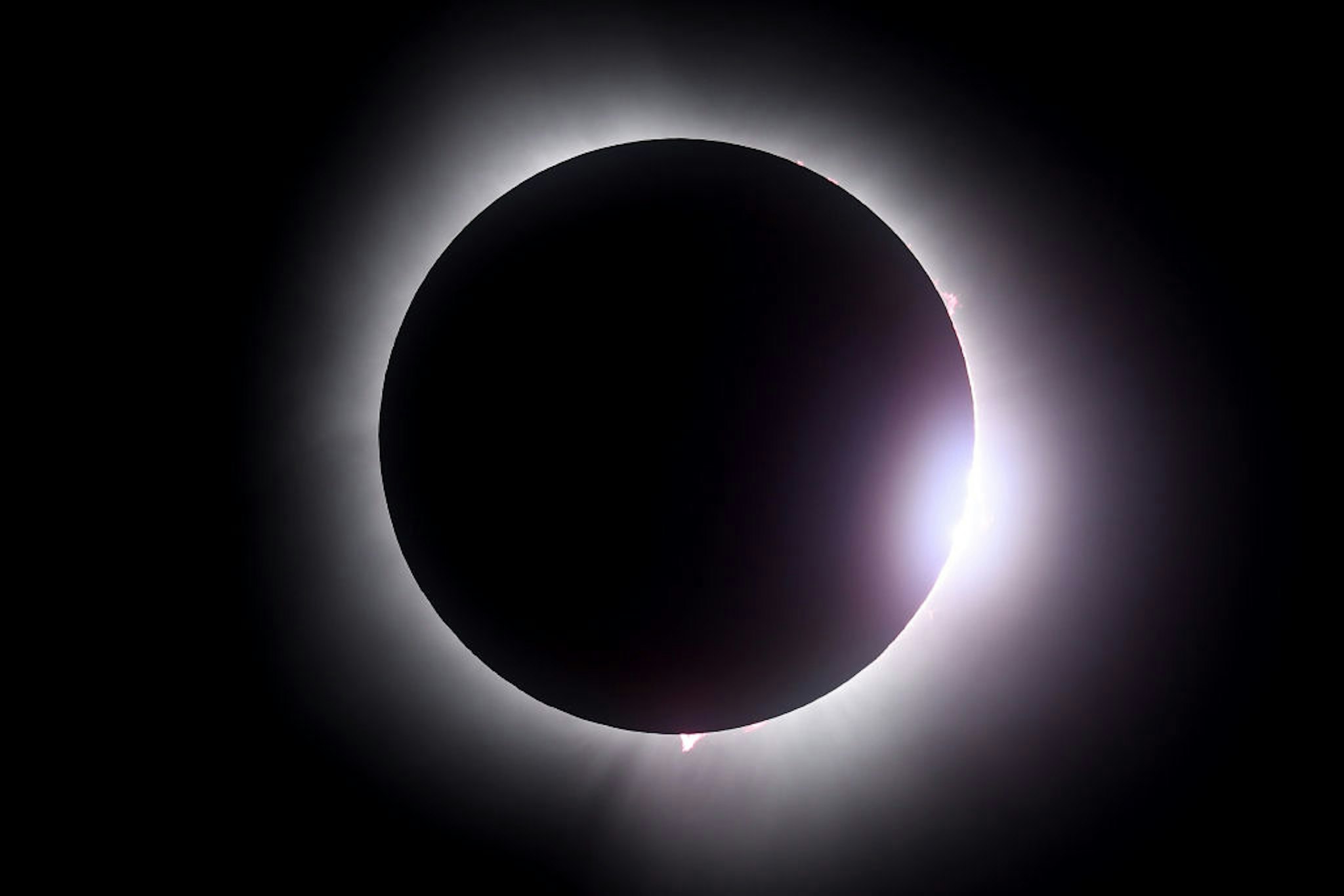 MARTIN, OHIO - APRIL 08: The moon passes in front of the sun during a solar eclipse on April 08, 2024 in Martin Ohio. Millions of people have flocked to areas across North America that are in the "path of totality" in order to experience a total solar eclipse. During the event, the moon will pass in between the sun and the Earth, appearing to block the sun. (Photo by Gregory Shamus/Getty Images)