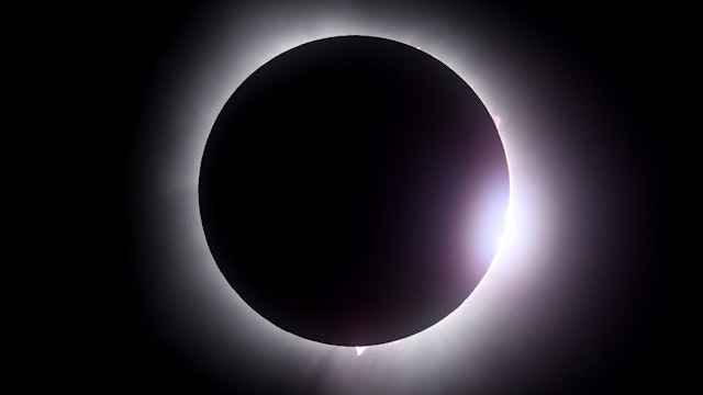 MARTIN, OHIO - APRIL 08: The moon passes in front of the sun during a solar eclipse on April 08, 2024 in Martin Ohio. Millions of people have flocked to areas across North America that are in the "path of totality" in order to experience a total solar eclipse. During the event, the moon will pass in between the sun and the Earth, appearing to block the sun. (Photo by Gregory Shamus/Getty Images)