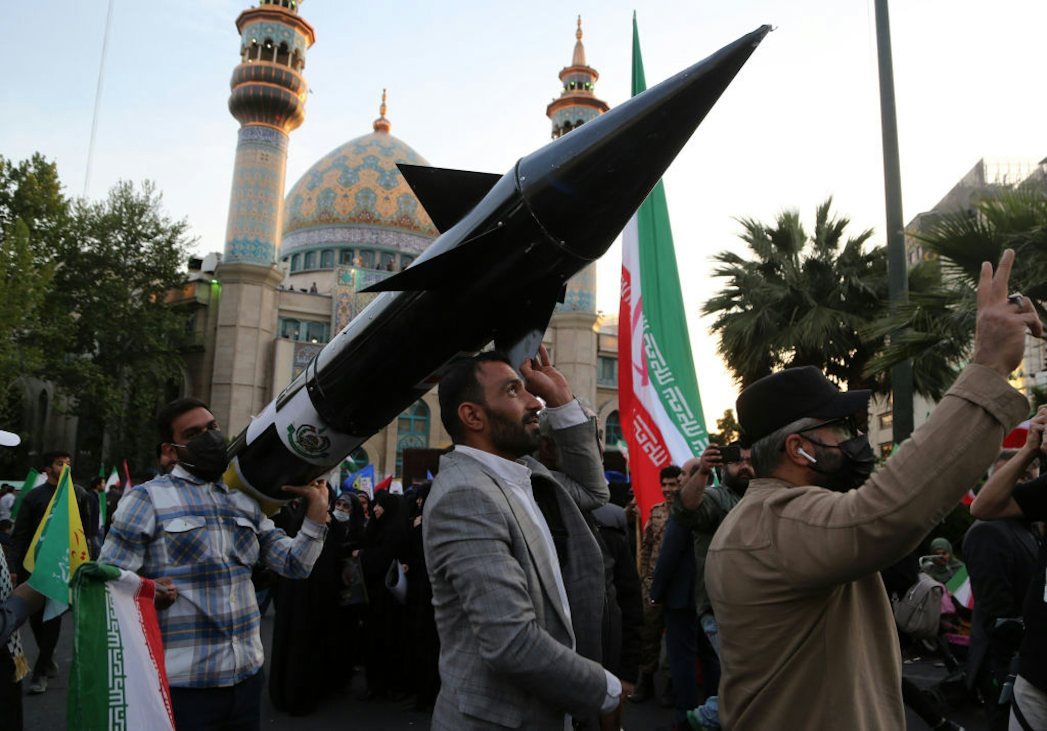 TEHRAN, IRAN - APRIL 15: A group gather in Palestine Square in the Iranian capital Tehran, staging a demonstration to support Iran's drone and missile attacks on Israel on April 15, 2024. Carrying Iranian and Palestinian flags, the demonstrators chanted slogans against Israel. (Photo by Fatemeh Bahrami/Anadolu via Getty Images)