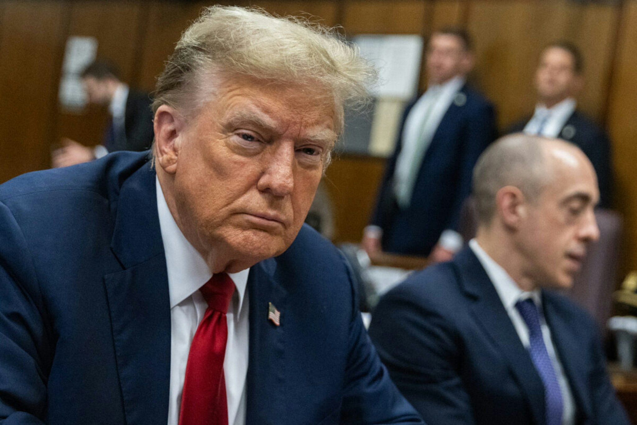 Former US President Donald Trump looks on at Manhattan criminal court in New York, on Monday, April 15, 2024. Donald Trump is in court Monday as the first US ex-president ever to be criminally prosecuted, a seismic moment for the United States as the presumptive Republican nominee campaigns to re-take the White House. The scandal-plagued 77-year-old is accused of falsifying business records in a scheme to cover up an alleged sexual encounter with adult film actress Stormy Daniels to shield his 2016 election campaign from adverse publicity.