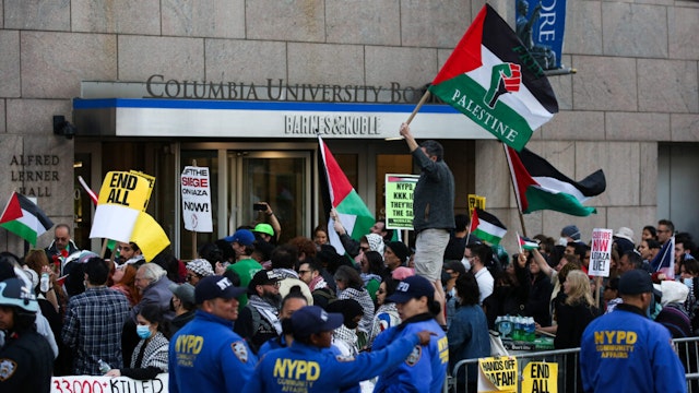 Pro-Palestinian activists protest outside Columbia University in New York City on April 20, 2024.
