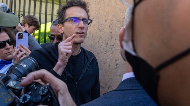 Assistant Professor Shai Davidai is denied access to the campus grounds during his pro-Israeili rally at Columbia University on April 22, 2024 in New York City. In response to recent campus unrest and anxieties regarding Jewish student safety, Columbia University President Minouche Shafik announced a shift to online learning for Monday. She further urged faculty and staff to prioritize remote work.