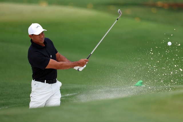 AUGUSTA, GEORGIA - APRIL 10: Tiger Woods of the United States takes a shot from the practice bunker during a practice round prior to the 2024 Masters Tournament at Augusta National Golf Club on April 10, 2024 in Augusta, Georgia. (Photo by Andrew Redington/Getty Images)