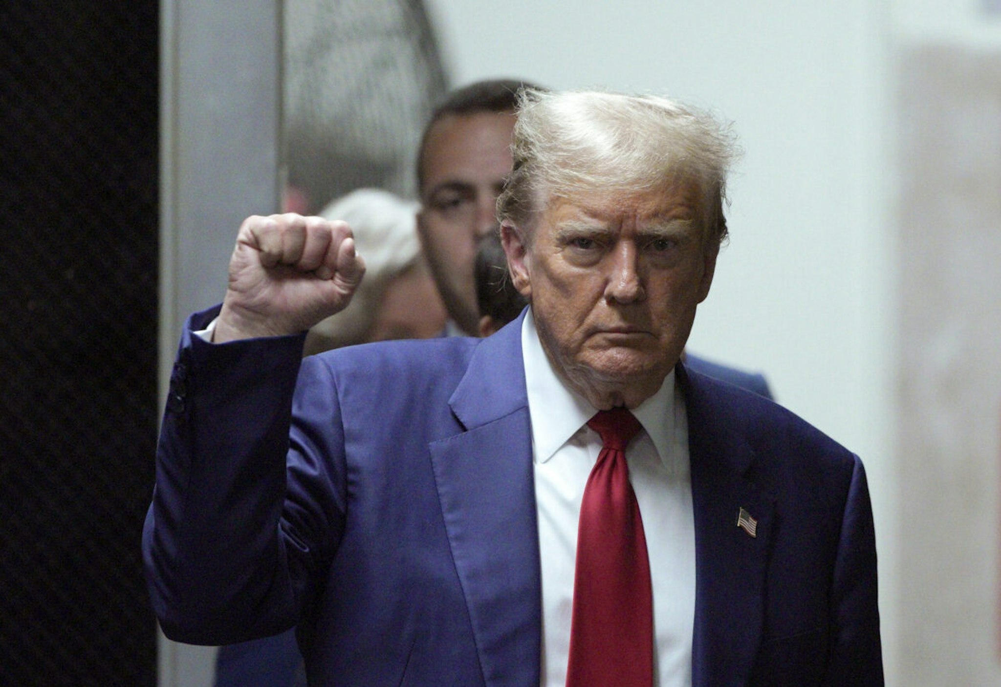 NEW YORK, NEW YORK - APRIL 30: Former U.S. President Donald Trump gestures as he returns to court during his trial for allegedly covering up hush money payments at Manhattan Criminal Court on April 30, 2024 in New York City. Former U.S. President Donald Trump faces 34 felony counts of falsifying business records in the first of his criminal cases to go to trial.