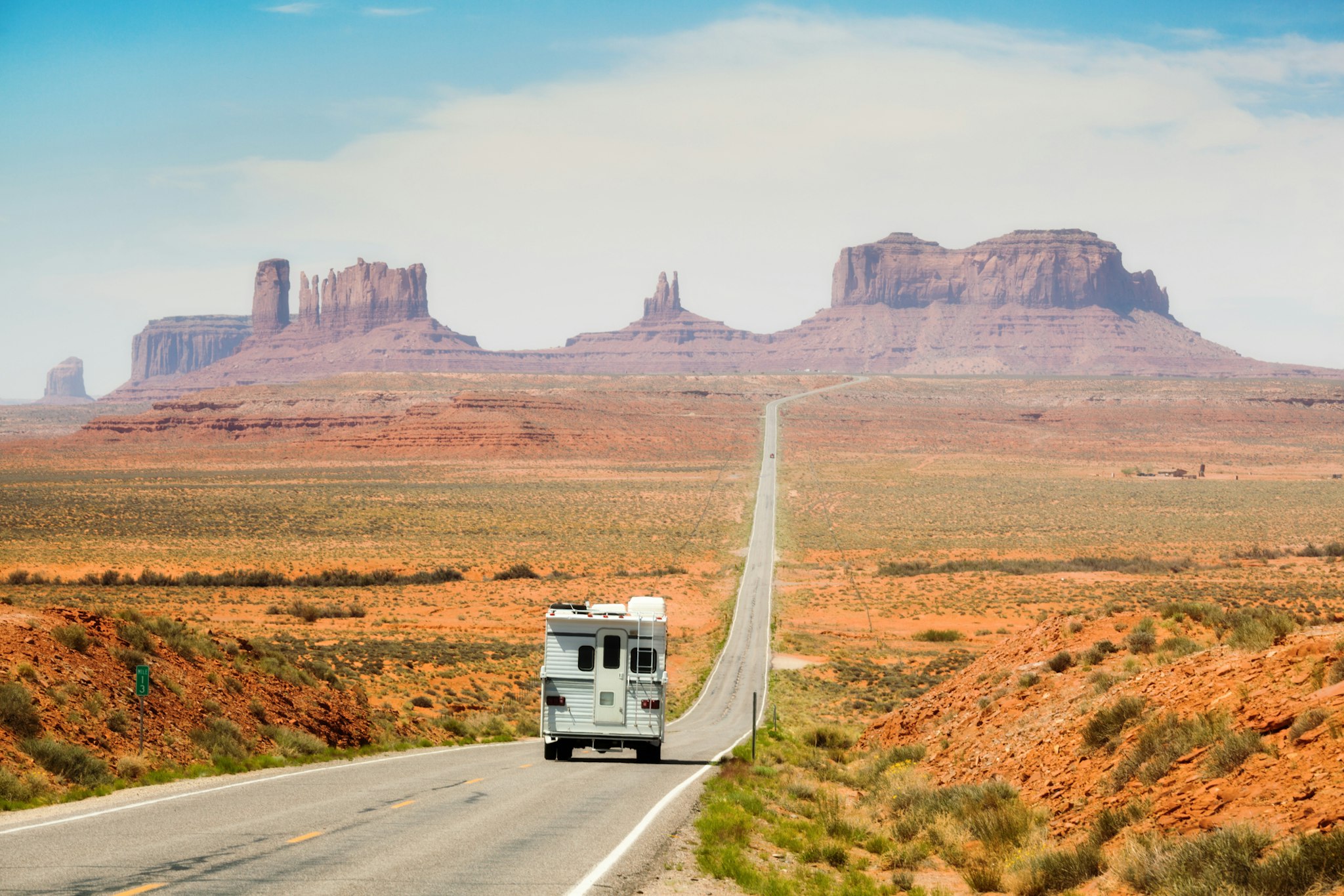 YinYang. Getty Images. Pickup camper recreational vehicle touring the American Southwest on a highway road trip near Monument Valley Tribal Park. Along the Utah and Arizona border, USA. The sandstone plateaus and rock formations are a campus place and travel destination for family vacations.