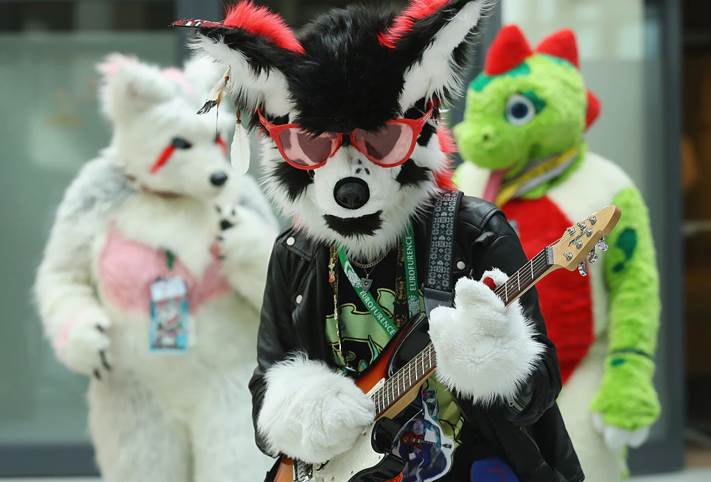 BERLIN, GERMANY - AUGUST 17: Participants, or furries, as they prefer to be called, dance upon their arrival at the Estrel Hotel for the 2016 Eurofurence furries gathering on August 17, 2016 in Berlin, Germany. Approximately 2,500 furries from all over the world will participate in the four-day convention that includes dance parties, fashion shows and art events. Furries describe themselves as anthroporphic actors and the movemment has its roots in science fiction and fantasy genres going back to the 1980s. (Photo by Sean Gallup/Getty Images)