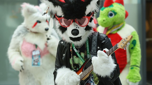 BERLIN, GERMANY - AUGUST 17: Participants, or furries, as they prefer to be called, dance upon their arrival at the Estrel Hotel for the 2016 Eurofurence furries gathering on August 17, 2016 in Berlin, Germany. Approximately 2,500 furries from all over the world will participate in the four-day convention that includes dance parties, fashion shows and art events. Furries describe themselves as anthroporphic actors and the movemment has its roots in science fiction and fantasy genres going back to the 1980s. (Photo by Sean Gallup/Getty Images)