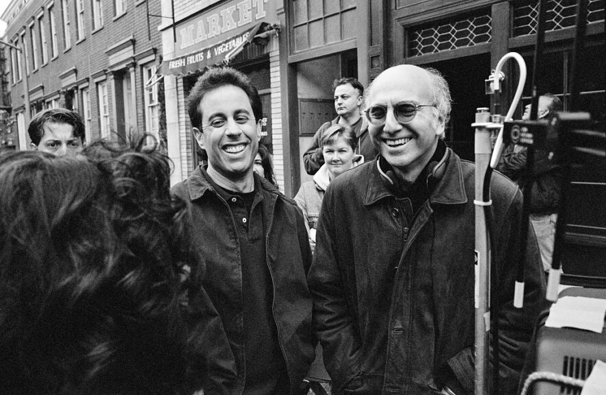 STUDIO CITY, CA - APRIL 3: (NO U.S. TABLOID SALES) Co-creators Jerry Seinfeld (second from left) and Larry David laugh while talking with actress Julia Louis-Dreyfus (back facing the camera) on set of the hit television show "Seinfeld" during the last episodes, April 3, 1998 in Studio City, California. (Photo by David Hume Kennerly/ Getty Images)