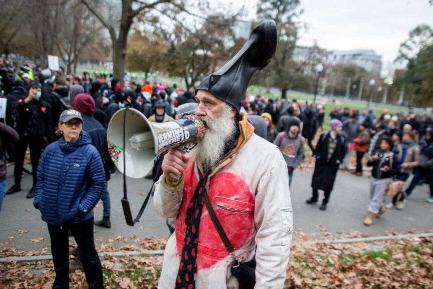 BOSTON, MA - NOVEMBER 18: Vermin Supreme speaks to police through his megaphone next to counter-protesters of an Alt-Right organized free speech event on the Boston Common on November 18, 2017 in Boston, Massachusetts. The "Rally for the Republic" event organized by conservative groups Resist Marxism and Boston Free Speech comes after thousands of counter-protesters shut down a similar demonstration in August. (Photo by Scott Eisen/Getty Images)
