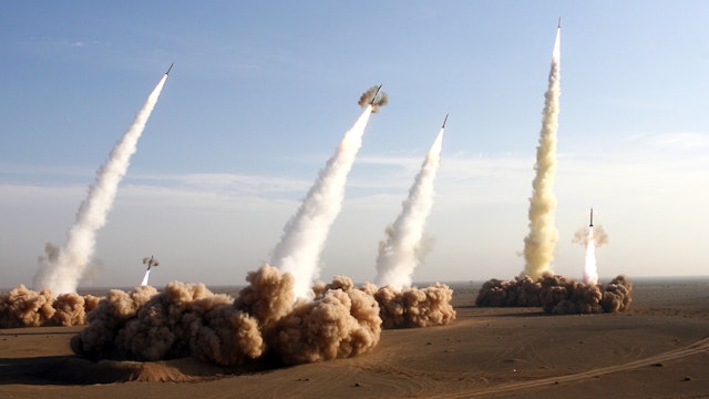 TOPSHOT - Iran's Revolutionary Guards fire test missiles during the first phase of military manoeuvres in the central desert outside the holy city of Qom, 02 November 2006. The Islamic republic fired its longer-range missile on exercise for the first time today as it began 10 days of war games amid a mounting standoff with the West over its nuclear programme.