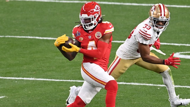LAS VEGAS, NEVADA - FEBRUARY 11: Rashee Rice #4 of the Kansas City Chiefs catches a pass in front of Logan Ryan #33 of the San Francisco 49ers during Super Bowl LVIII at Allegiant Stadium on February 11, 2024 in Las Vegas, Nevada.