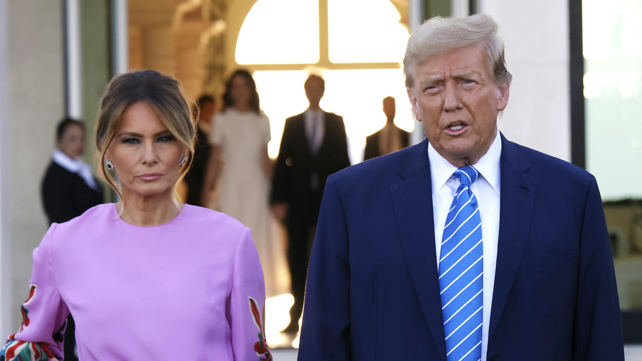 PALM BEACH, FLORIDA - APRIL 6: Republican presidential candidate, former US President Donald Trump, arrives at the home of billionaire investor John Paulson, with former first lady Melania Trump, on April 6, 2024 in Palm Beach, Florida. Donald Trump's campaign is expecting to raise more than 40 million dollars when major donors gather for his biggest fundraiser yet. The event is billed as the "Inaugural Leadership Dinner".