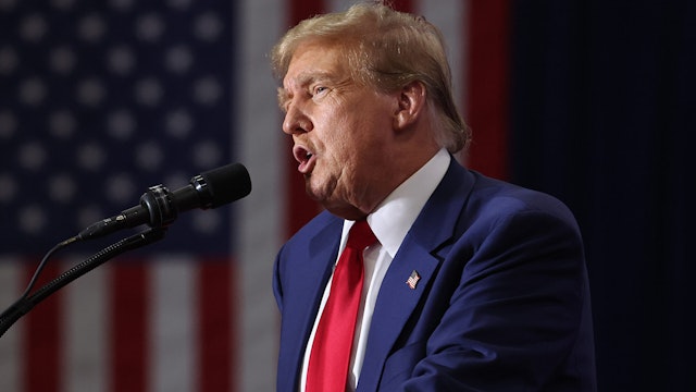 GREEN BAY, WISCONSIN - APRIL 02: Former President Donald Trump speaks to guests at a rally on April 02, 2024 in Green Bay, Wisconsin. At the rally, Trump spoke next to an empty lectern on the stage and challenged President Joe Biden to debate him. The Wisconsin primary is being held today.
