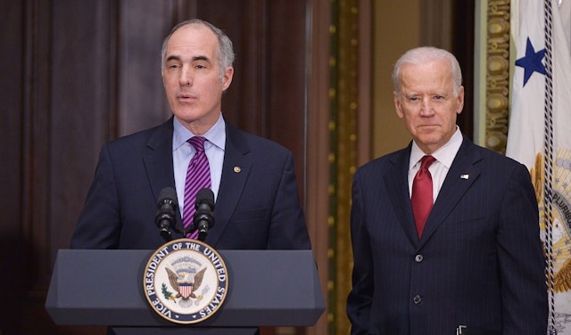 Senator Bob Casey, D-PA, introduces US Vice President Joe Biden during an event with members of Congress to highlight the benefits of the ABLE (Achieving Better Life Expectancy) Act in the Eisenhower Executive Office Building, next to the White House on February 10, 2015 in Washington, DC. (MANDEL NGAN/AFP via Getty Images)