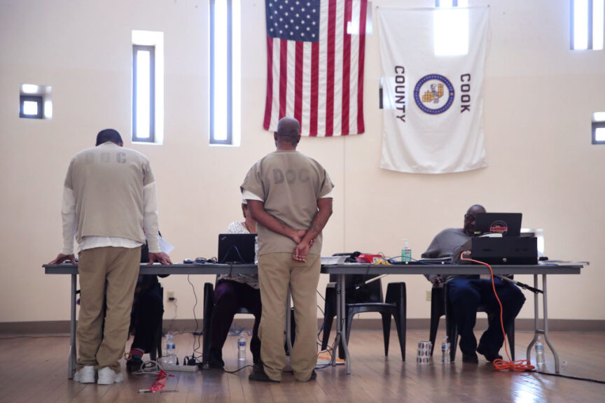 CHICAGO, ILLINOIS - MARCH 07: Inmates at the Cook County Jail check in with election judges before voting in the Illinois primary election after a polling place in the facility was opened for early voting on March 07, 2020 in Chicago, Illinois. About 500 to 700 inmates were expected to vote today inside the facility which houses more than 5,000 detainees. The jail is the first in the nation to open a polling place inside to allow inmates to vote. The Illinois primary election will be held on March 17. (Photo by Scott Olson/Getty Images)