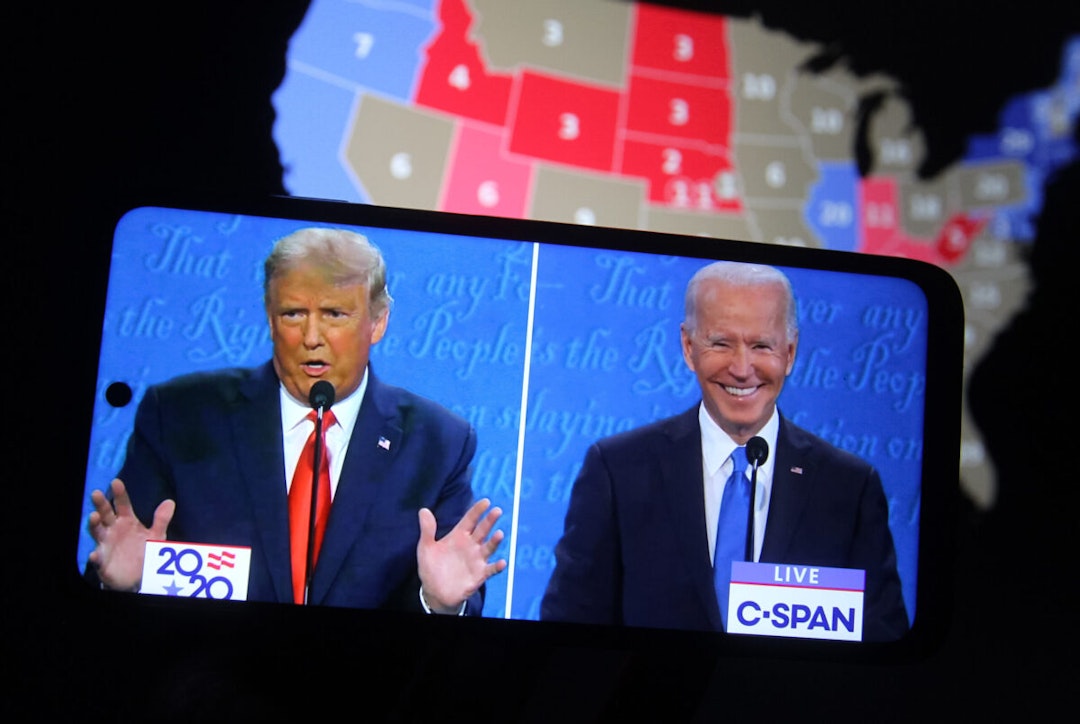 In this photo illustration the US President Donald Trump and Democratic presidential candidate and former US Vice President Joe Biden are seen during the final presidential debate displayed on a screen of a smartphone. The final presidential debate between President Donald Trump and former Vice President Joe Biden took place at Belmont University in Nashville, the U.S. on Thursday, October 22.