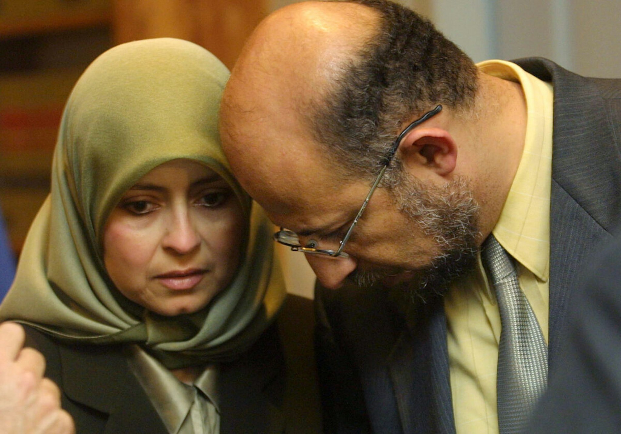 TAMPA, FL - AUGUST 22: University of South Florida tenured computer science professor Sami Al-Arian (R) speaks with his wife Nahla before a news conference August 22, 2002 in Tampa, Florida. The school filed a lawsuit August 21, 2002 against Al-Arian that would allow the university to fire him on charges of alleged ties to militant Islamic groups if a court rules that the termination would not be a violation of Al-Arian's constitutional rights. The Palestinian professor denied the charges and said that he would fight for his job.