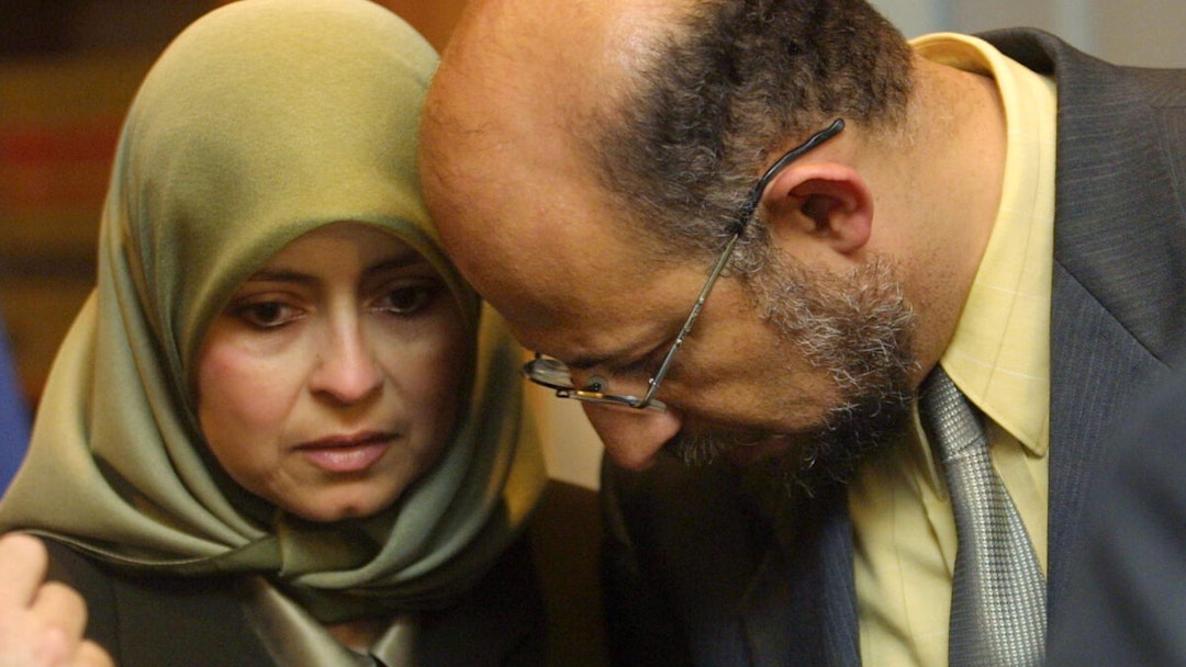 TAMPA, FL - AUGUST 22: University of South Florida tenured computer science professor Sami Al-Arian (R) speaks with his wife Nahla before a news conference August 22, 2002 in Tampa, Florida. The school filed a lawsuit August 21, 2002 against Al-Arian that would allow the university to fire him on charges of alleged ties to militant Islamic groups if a court rules that the termination would not be a violation of Al-Arian's constitutional rights. The Palestinian professor denied the charges and said that he would fight for his job.