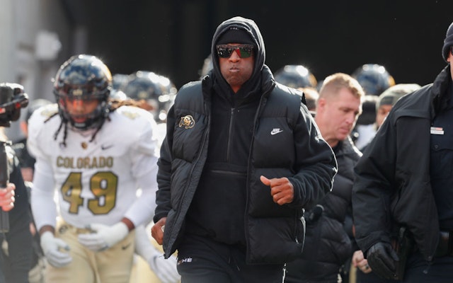 SALT LAKE CITY, UT - NOVEMBER 25: Deion Sanders head coach of the Colorado Buffaloes leads his team onto the field before the start of their game agaisnt the Utah Utes at Rice Eccles Stadium on November 25, 2023 in Salt Lake City, Utah. (Photo by Chris Gardner/Getty Images)
