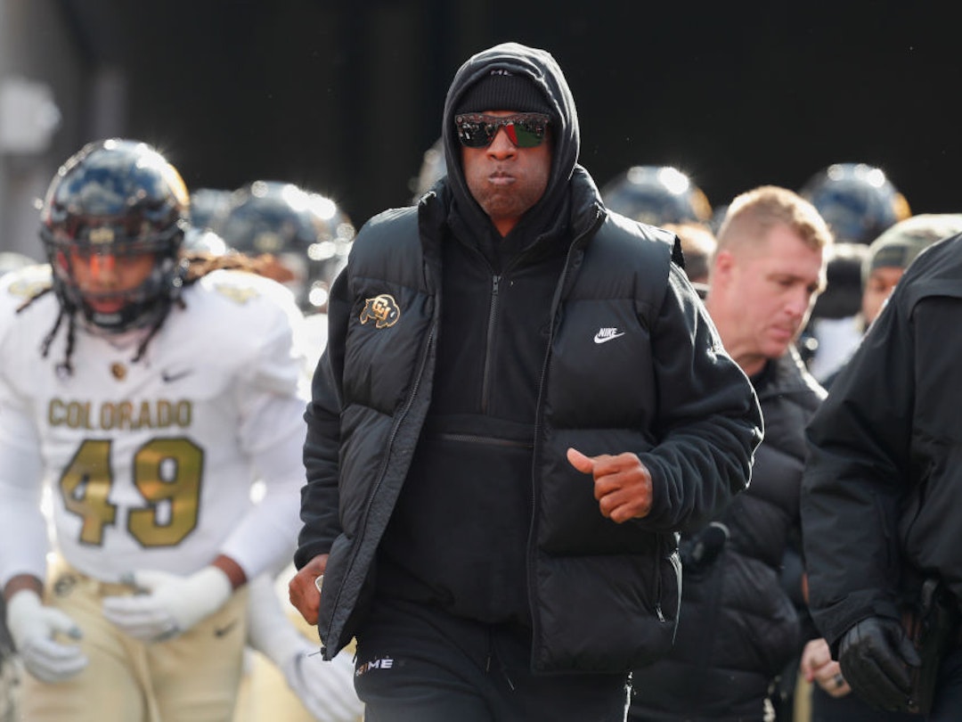 SALT LAKE CITY, UT - NOVEMBER 25: Deion Sanders head coach of the Colorado Buffaloes leads his team onto the field before the start of their game agaisnt the Utah Utes at Rice Eccles Stadium on November 25, 2023 in Salt Lake City, Utah. (Photo by Chris Gardner/Getty Images)