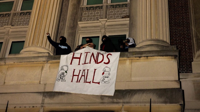 NEW YORK, NEW YORK - APRIL 29: Demonstrators from the pro-Palestine encampment on Columbia's Campus show a banner as they barricade themselves inside Hamilton Hall, they barricade themselves inside Hamilton Hall, an academic building which has been occupied in past student movements,, and name it after a Palestinian child allegedly killed by the Israeli military on Tuesday, April 30, 2024 in New York City.