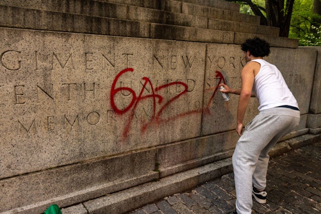 NEW YORK, NEW YORK - MAY 6: A pro-Palestine protestor writes Gaza on a memoriam near Central Park during a march on the outskirts of the Met Gala on May 6, 2024 in New York City. A demonstration at Hunter College drew around 200 protesters, who joined other area-college marches to the Met Gala being held this evening at the Metropolitan Museum of Art.