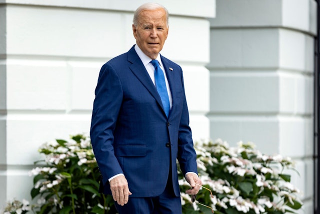 US President Joe Biden walks on the South Lawn of the White House before boarding Marine One in Washington, DC, US, on Wednesday, May 8, 2024. Biden will champion a major Microsoft Corp. investment in swing-state Wisconsin, drawing a contrast with his 2024 rival Donald Trump, whose own plans for a flagship technology project by Foxconn at the same site fizzled. Photographer: Samuel Corum/Sipa/Bloomberg via Getty Images