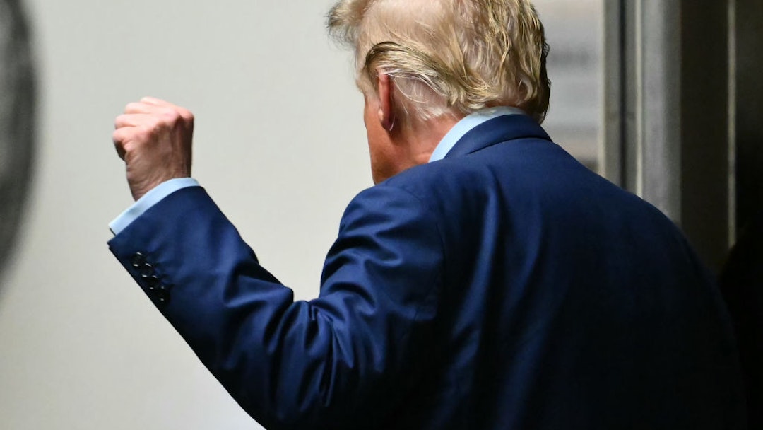 NEW YORK, NEW YORK - MAY 9: Former U.S. President Donald Trump raises his fist as he leaves for a break in his trial for allegedly covering up hush money payments at Manhattan Criminal Court on May 9, 2024 in New York City. Trump was charged with 34 counts of falsifying business records last year, which prosecutors say was an effort to hide a potential sex scandal, both before and after the 2016 presidential election. Trump is the first former U.S. president to face trial on criminal charges. (Photo by Angela Weiss-Pool/Getty Images)