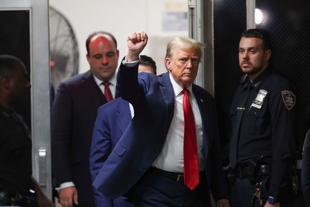 NEW YORK, NEW YORK - MAY 16: Former U.S. President Donald Trump gestures as he returns to court followed by his advisor Boris Epshteyn at Manhattan Criminal Court on May 16, 2024 in New York City. Former U.S. President Donald Trump faces 34 felony counts of falsifying business records in the first of his criminal cases to go to trial.