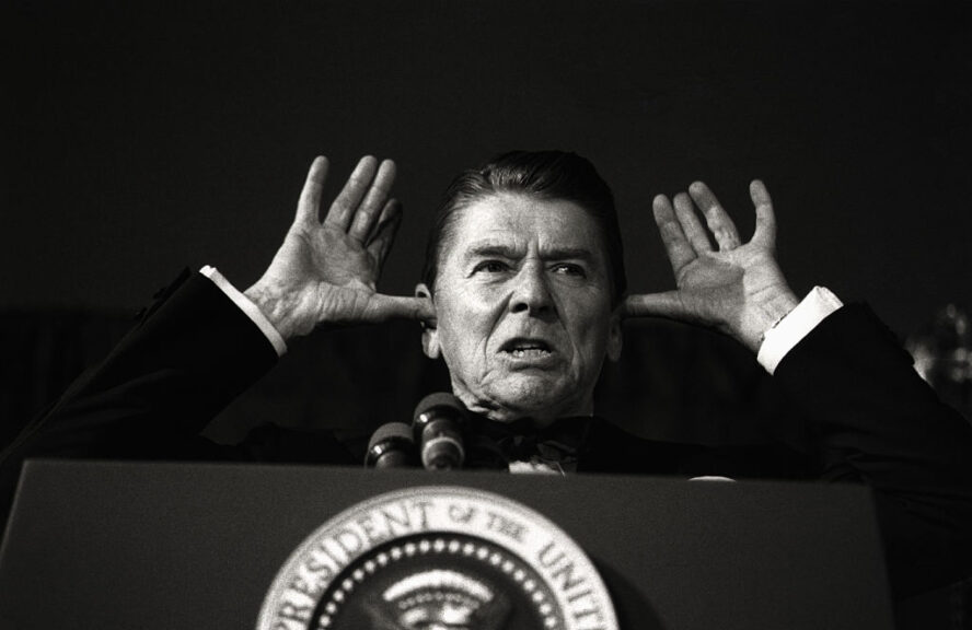 While addressing the audience at the White House News Photographers Association dinner, President Reagan said, "I've been told this is all off the record and the cameras are off and I've been waiting years to do this."