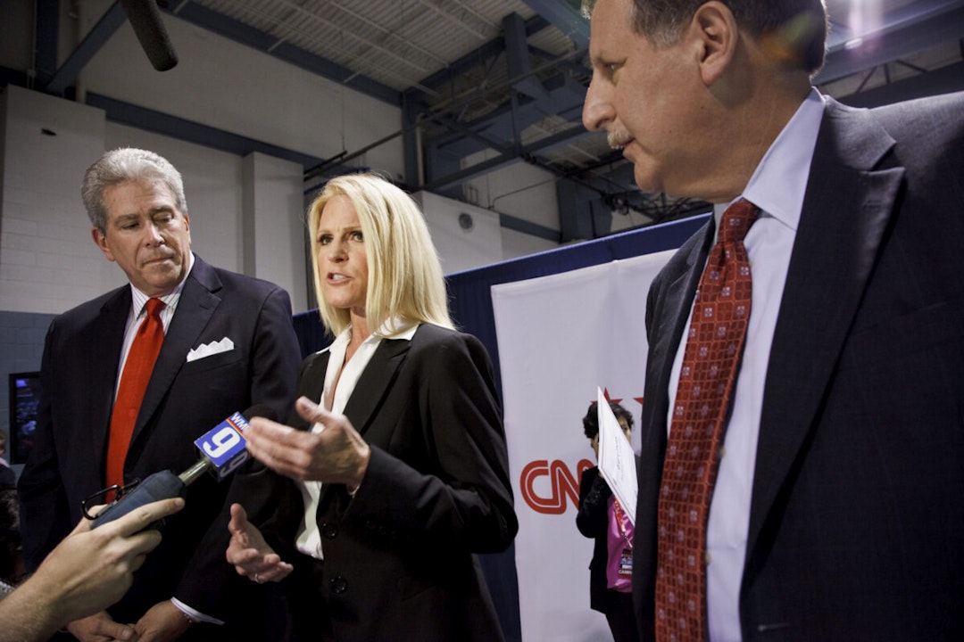 (L-R) Ed Goeas, Alice Stewart and Bob Heckman speaking for Michele Bachman in the spin room after The New Hampshire Republican Presidential Debate at Saint Anselm College in Manchester.