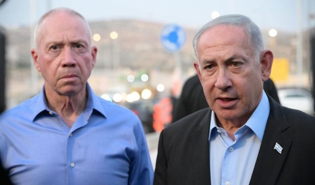 Israeli Prime Minister Benjamin Netanyahu (R) and Israeli Defense Minister Yoav Gallant (L) visit the site of the shooting where a settler was killed and another seriously injured in Hebron, West Bank on August 21, 2023. (Photo by Amos Ben-Gershom (GPO) / Handout/Anadolu Agency via Getty Images)