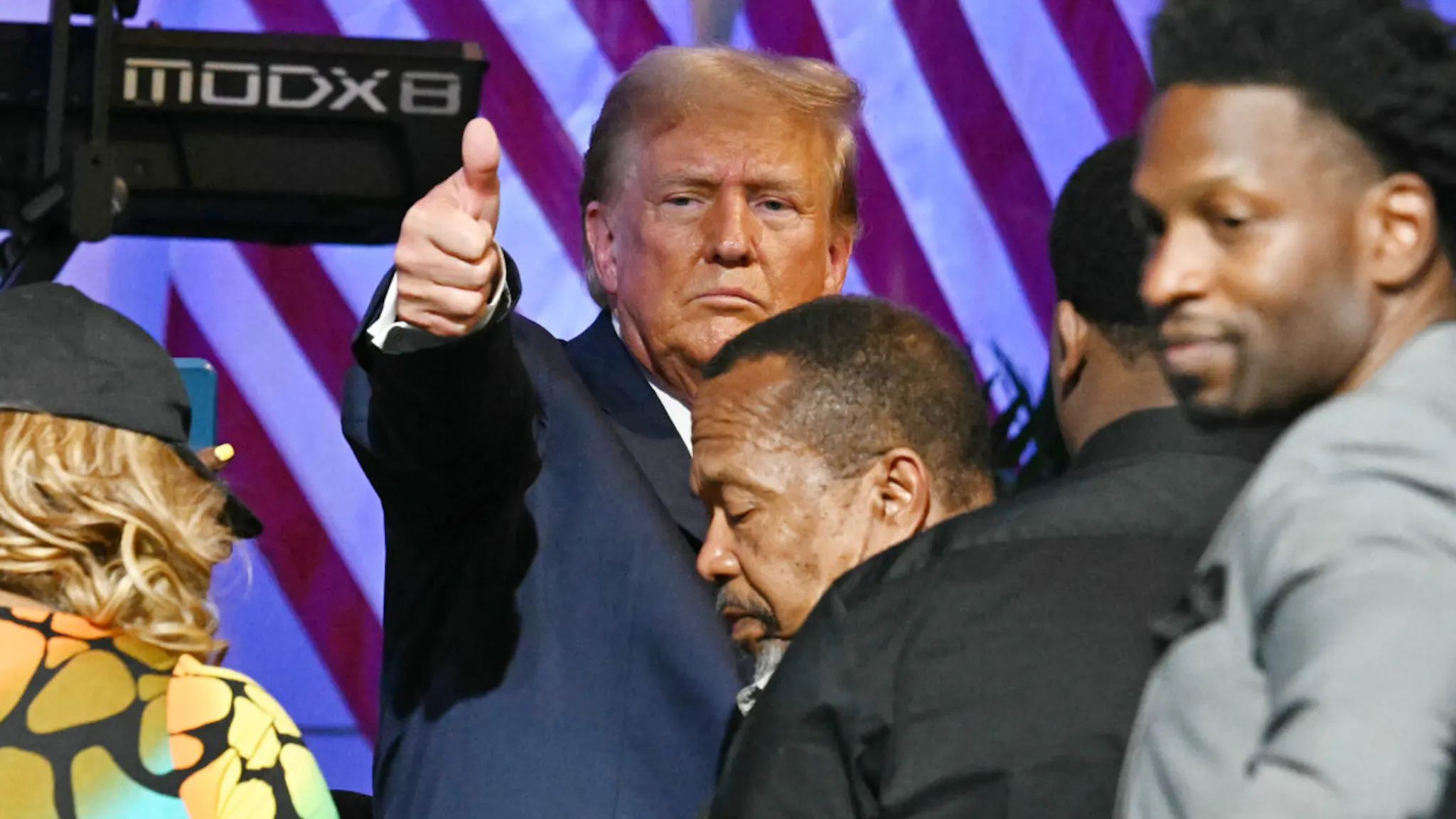 Donald Trump Former US President and Republican presidential candidate Donald Trump acknowledges the crowd after participating in a community roundtable at the 180 Church in Detroit, Michigan, on June 15, 2024.