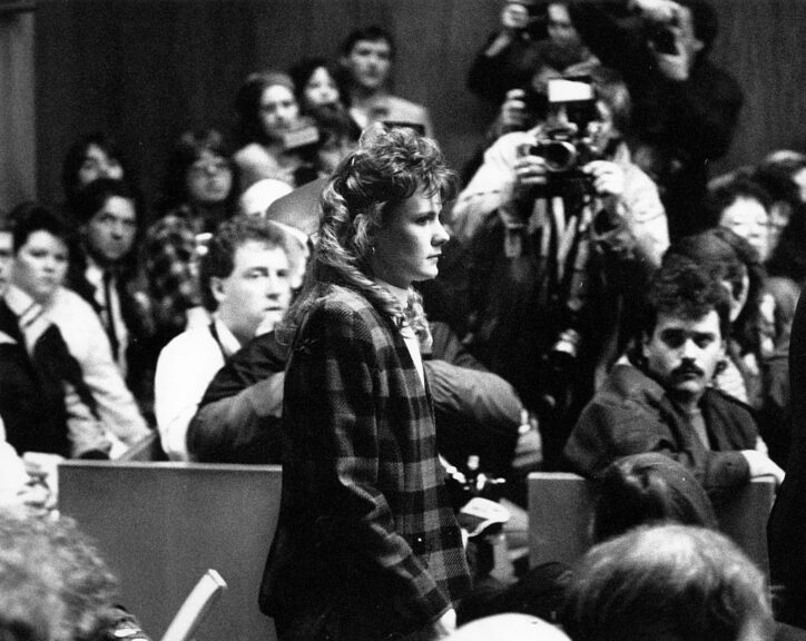 EXETER, NH - MARCH 22: Pamela Smart, 23, enters the Rockingham County Superior Court courtroom in Exeter, N.H. for the verdict in her trial on March 22, 1991. Smart was convicted of being an accomplice to first-degree murder for luring her 15-year-old lover and his two teenage friends into executing her plot to kill her husband, Gregory Smart. The judge immediately sentenced her to life in prison without the possibility of parole. She was also found guilty of murder conspiracy and witness tampering, for which she was sentenced at a later date. (Photo by Tom Landers/The Boston Globe via Getty Images)