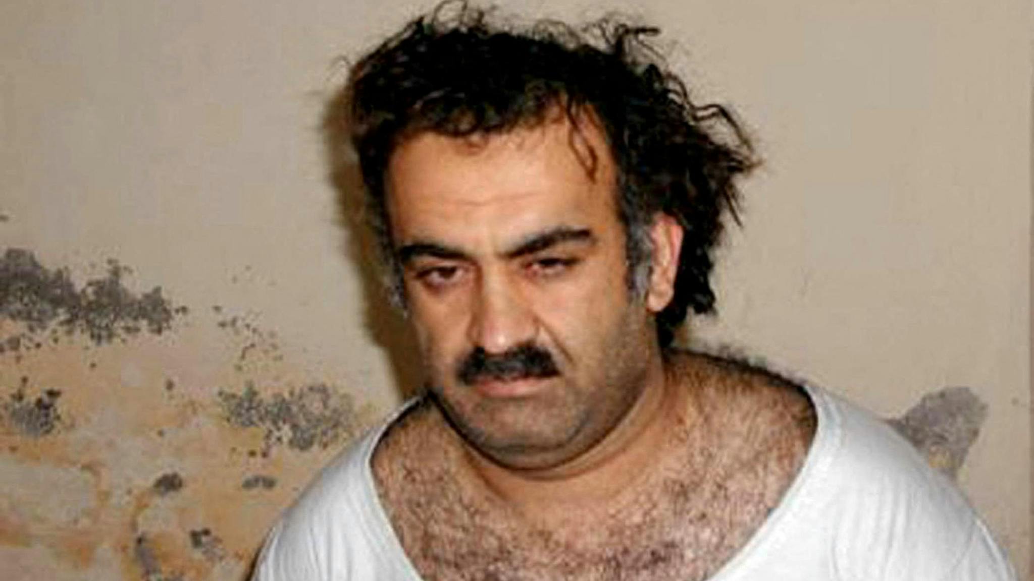 Khalid Sheikh Mohammed This photo obtained 01 March, 2003, shows, Khalid Sheikh Mohammed, alleged organizer of the September 11, 2001, attacks, shortly after his capture. US officials investigating the murder of Wall Street Journal reporter Daniel Pearl now believe he was personally slain by Mohammed. The Journal reported 21 October, 2003, that White House administration officials had developed credible, corroborated information that Mohammed was "directly involved" in Pearl's murder. Pearl was kidnapped on January 23 last year in the Pakistani city of Karachi where he was investigating Islamic militancy. A scratchy video of Pearl's throat being cut was delivered to the US consulate on February 21. It took until May 2002 to find his remains.
