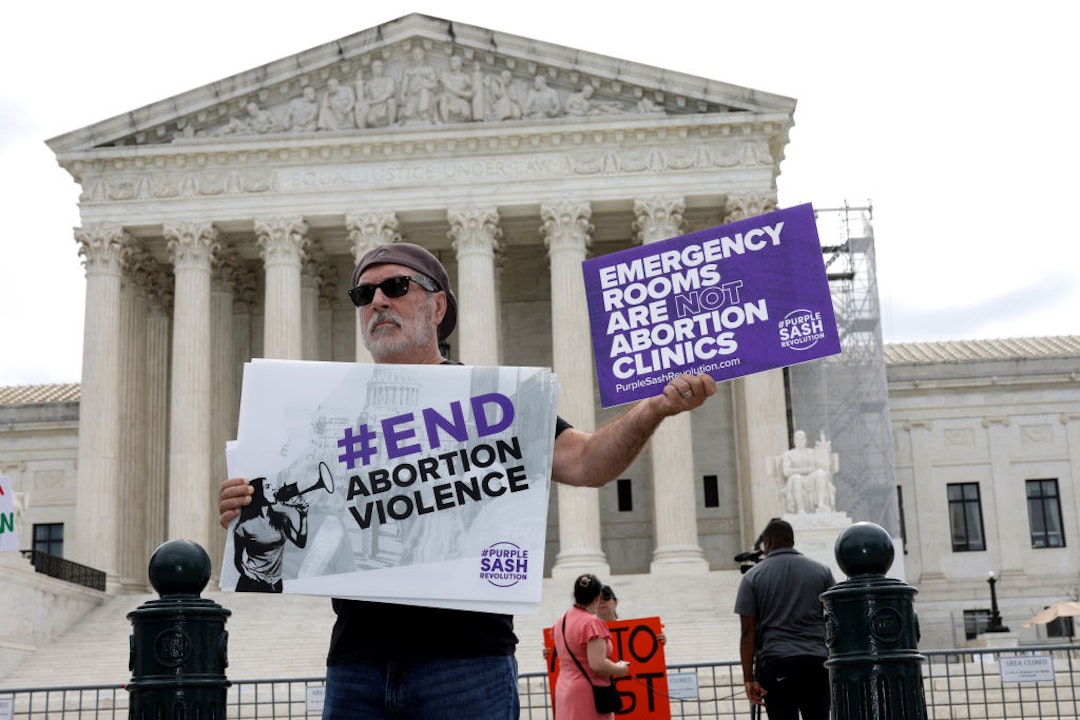 WASHINGTON, DC - JUNE 27: Protesters demonstrate outside of the U.S. Supreme Court on June 27, 2024 in Washington, DC. The Supreme Court issued four rulings today, including allowing emergency abortions in Idaho while the case makes its way through the courts, overturning a bankruptcy plan for Purdue Pharma and their payment for their involvement in the opioid crisis, stripping the Securities and Exchange Commission (SEC) of enforcement powers to penalize fraud and blocking an Environmental Protection Agency air-quality initiative while appeals continue. (Photo by Alex Wong/Getty Images)