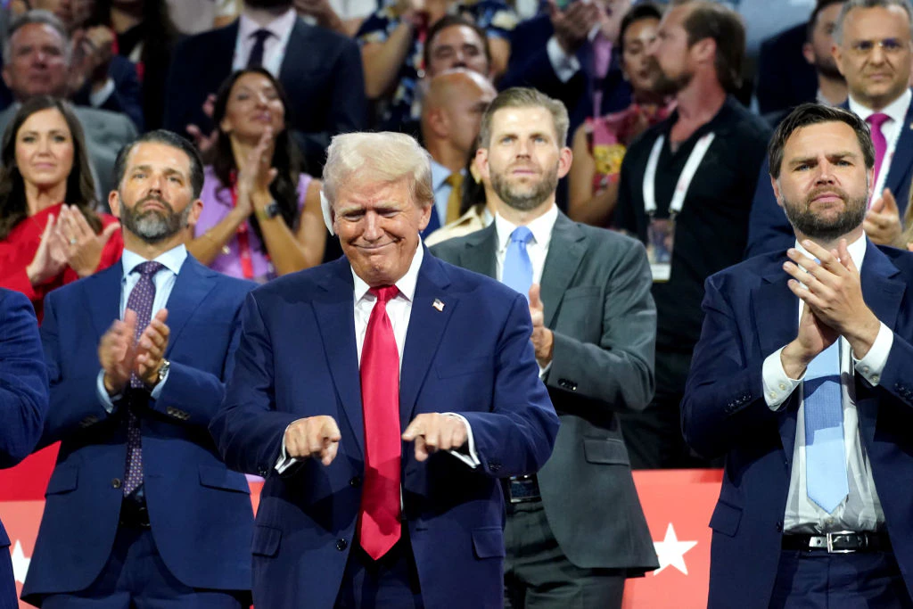 Former US President Donald Trump, left, and Senator JD Vance, a Republican from Ohio and Republican vice-presidential nominee, right, during the Republican National Convention (RNC) at the Fiserv Forum in Milwaukee, Wisconsin, US, on Monday, July 15, 2024. Former President Donald Trump tapped JD Vance as his running mate, elevating to the Republican presidential ticket a venture capitalist-turned-senator whose embrace of populist politics garnered national attention and made him a rising star in the party. Photographer: Al Drago/Bloomberg via Getty Images