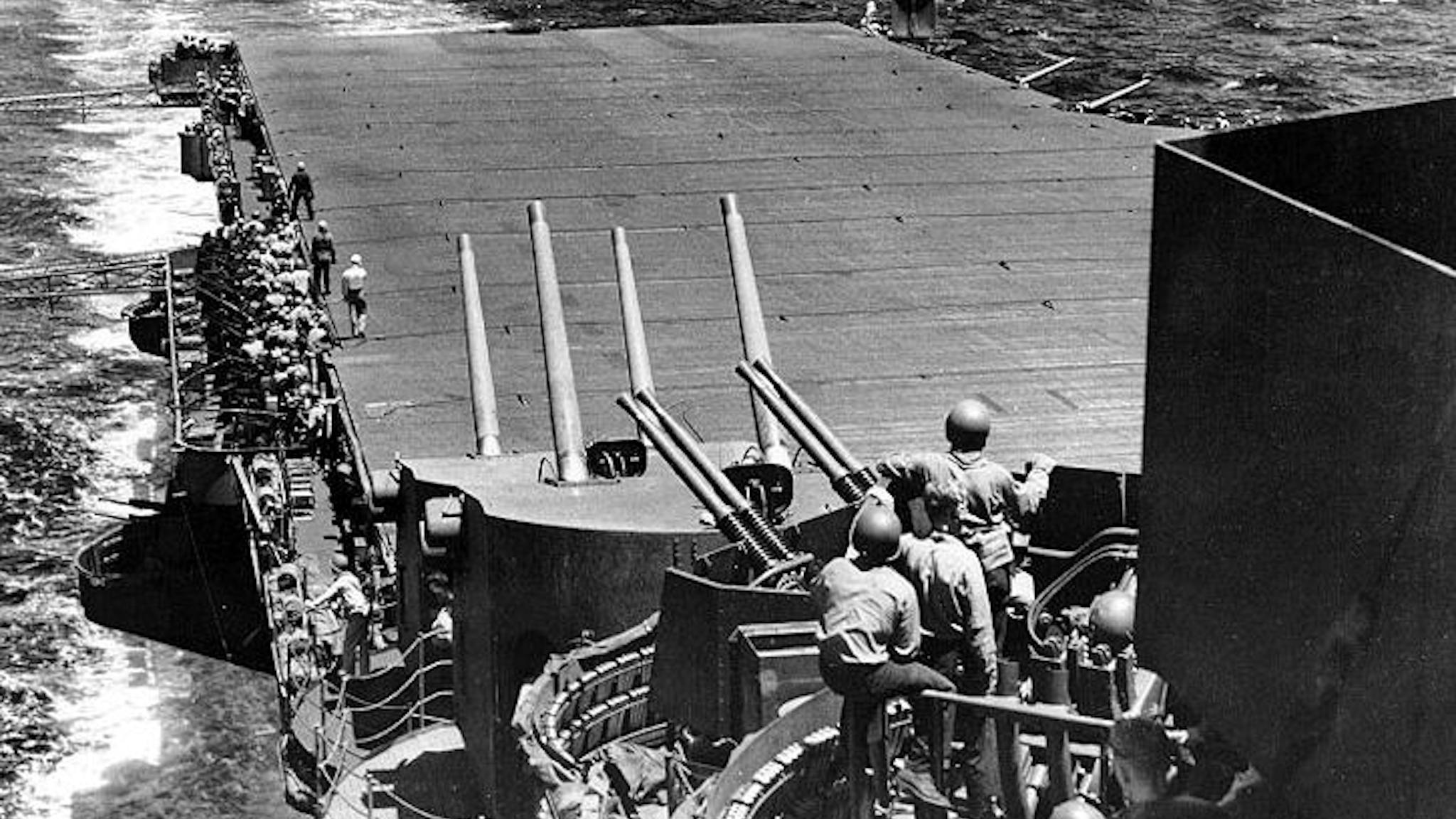USS_Lexington_(CV-16)_Philippine_Sea Grumman F6F-3 fighter landing aboard the Essex Class carrier USS Lexington (CV-16) - flagship of Task Force 58 - during the Battle of the Philippine Sea, June 1944. Official US Navy Photograph. (Enhancement by DLJ - Wild Surmise). Wikimedia Commons.