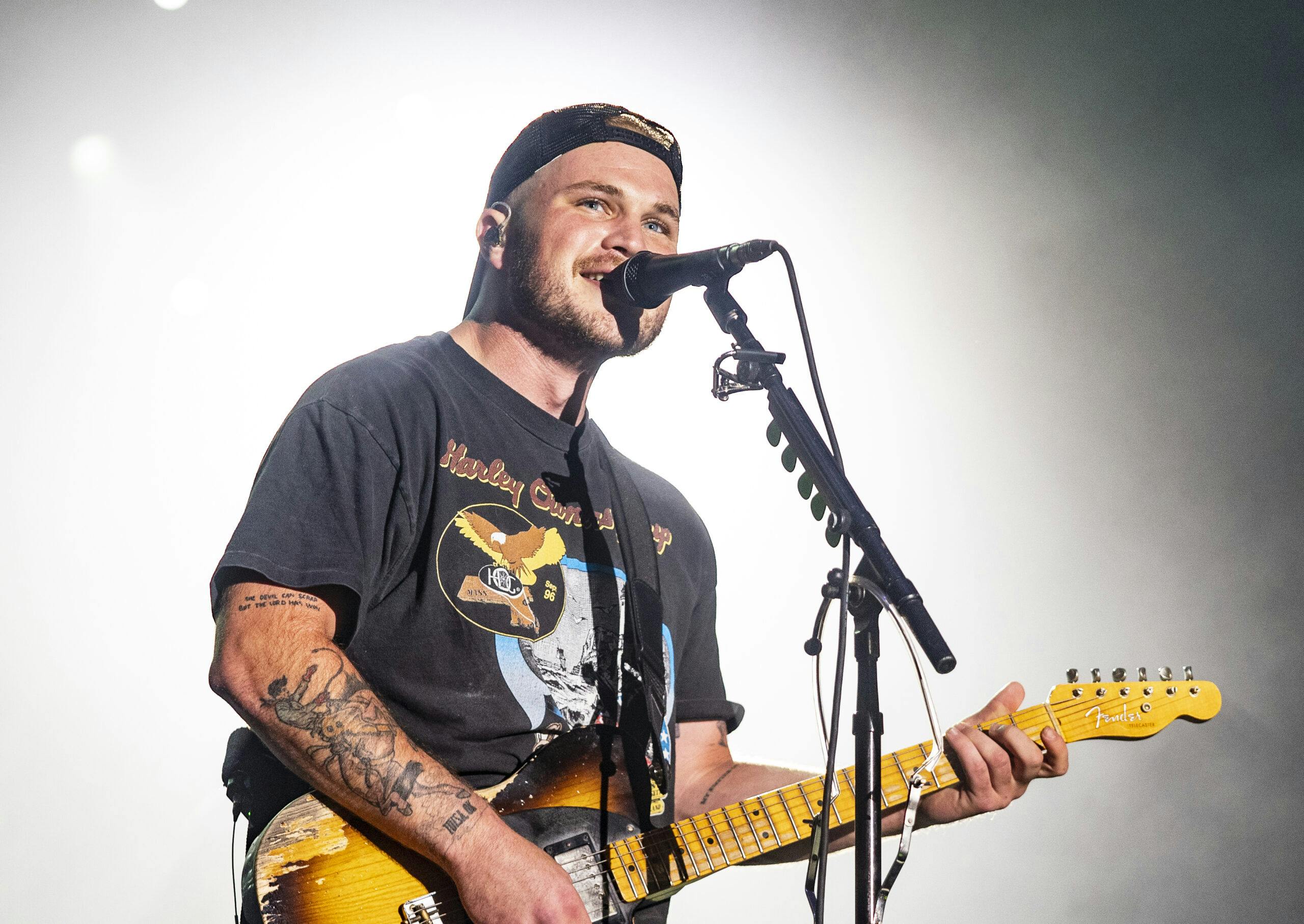 Zach Bryan Invites Viral ‘Hawk Tuah’ Girl Onstage During Nashville Concert