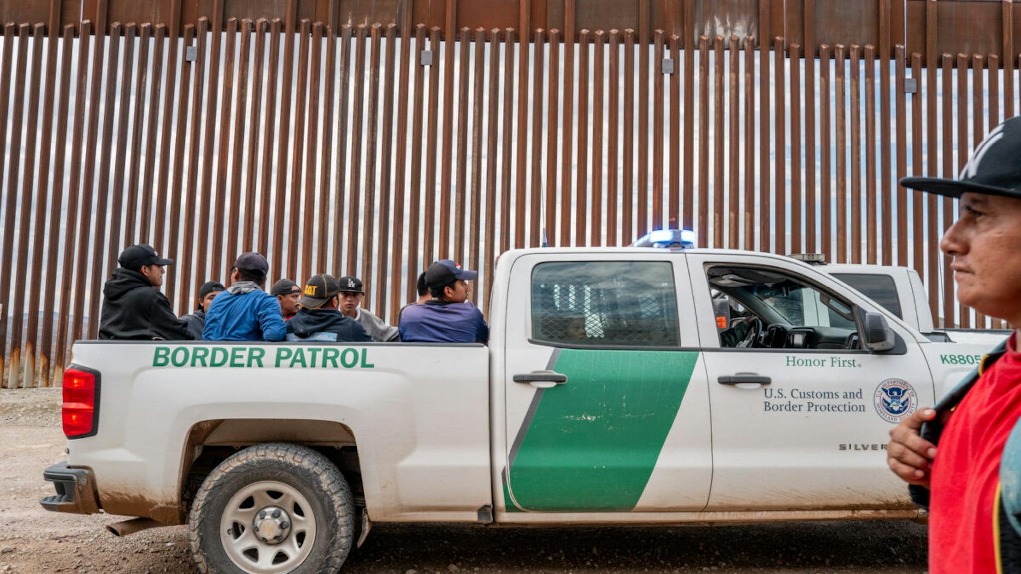 Border Crossings RUBY, ARIZONA - JUNE 24: Migrants seeking asylum from Central and South America sit in the back of a border patrol vehicle after being apprehended by U.S. Customs and Border protection officers after illegally crossing over into the U.S. on June 24, 2024 in Ruby, Arizona. President Joe Biden has announced an immigration relief plan, which promises a path to citizenship for approximately 500,000 undocumented immigrants married to or adopted by U.S. citizens. Day's after Biden's announcement, Republican presidential candidate, former U.S. President Donald Trump announced to a podcast host that he would solidify green cards for foreign nationals who've received a U.S. college diploma.