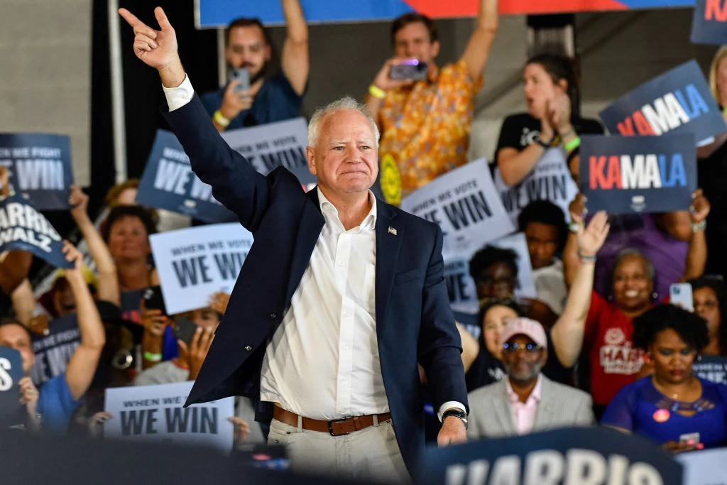 ROMULUS, MICHIGAN - AUGUST 7, 2024: Vice President nominee and current Minnesota Governor Tim Walz takes the stage to speak to several thousand attendees at a Harris-Walz presidential campaign rally at Detroit Metropolitan Wayne County Airport in Romulus, MI on August 7, 2024. (Photo by Adam J. Dewey/Anadolu via Getty Images)